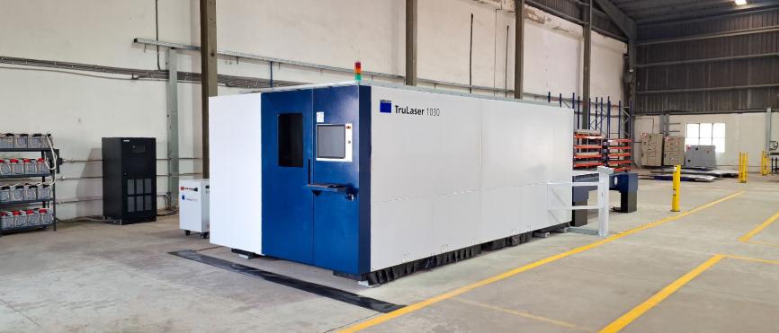 Trumpf TruLaser 1030 fiber laser cutting machine installed in Mech Power sheet metal fabrication facility.